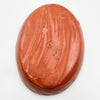 Reddish-brown stone with a visible brand logo on a white background