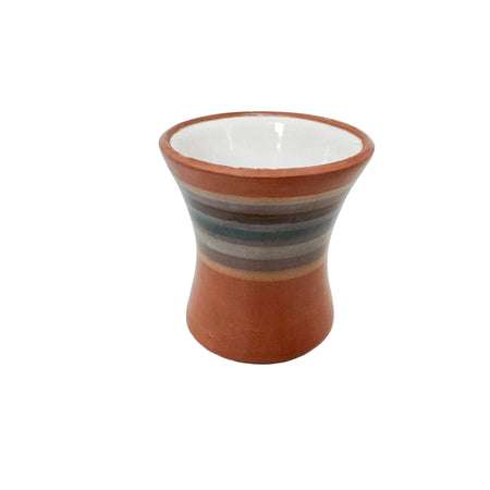 Ceramic vase with striped design on a white background