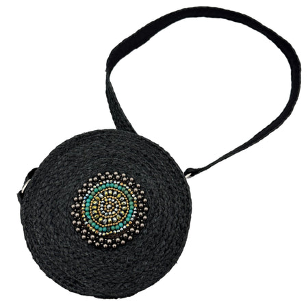 Black round handbag with bead embellishments on a white background