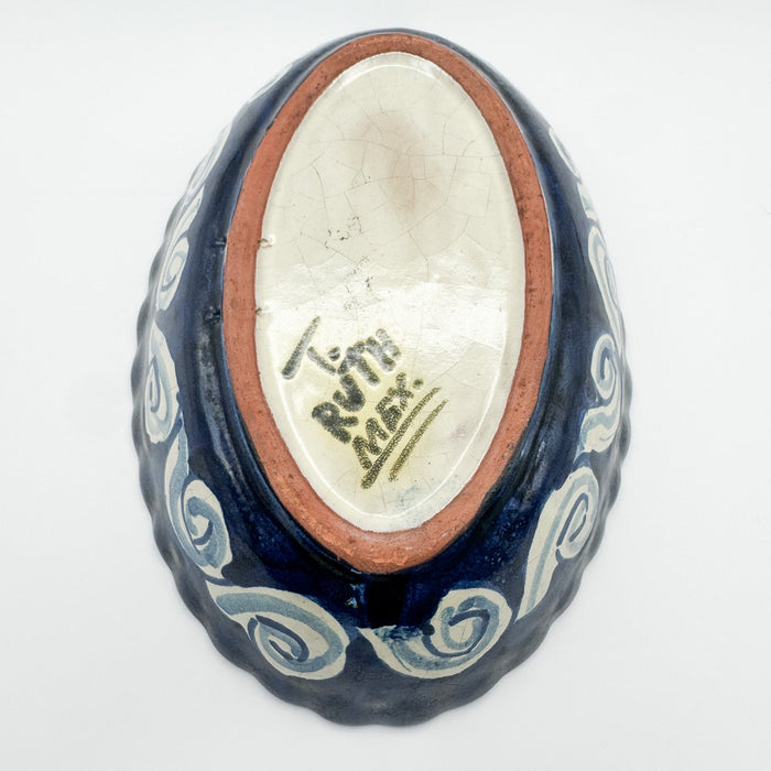 Ceramic bowl with blue patterns and a visible brand name on a white background